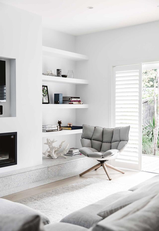 Light grey and white modern living room with shelving storage
