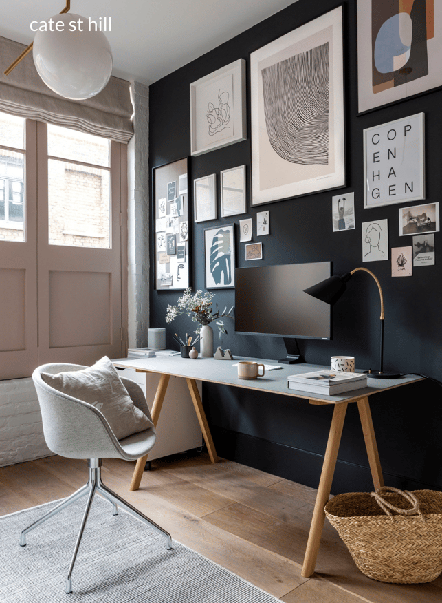 dark feature wall home office design with gallery wall 