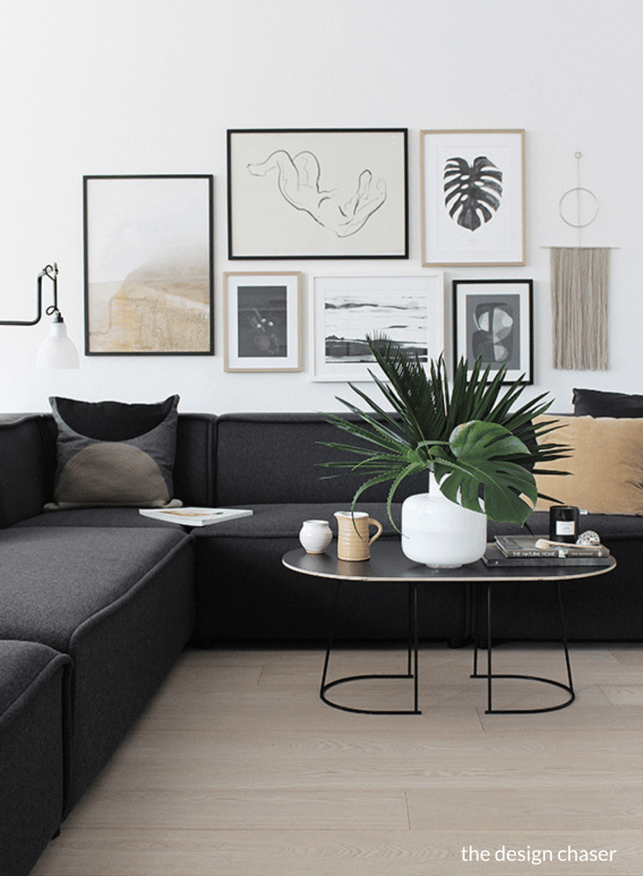 the design chaser gallery wall in bohemian scandinavian living room 